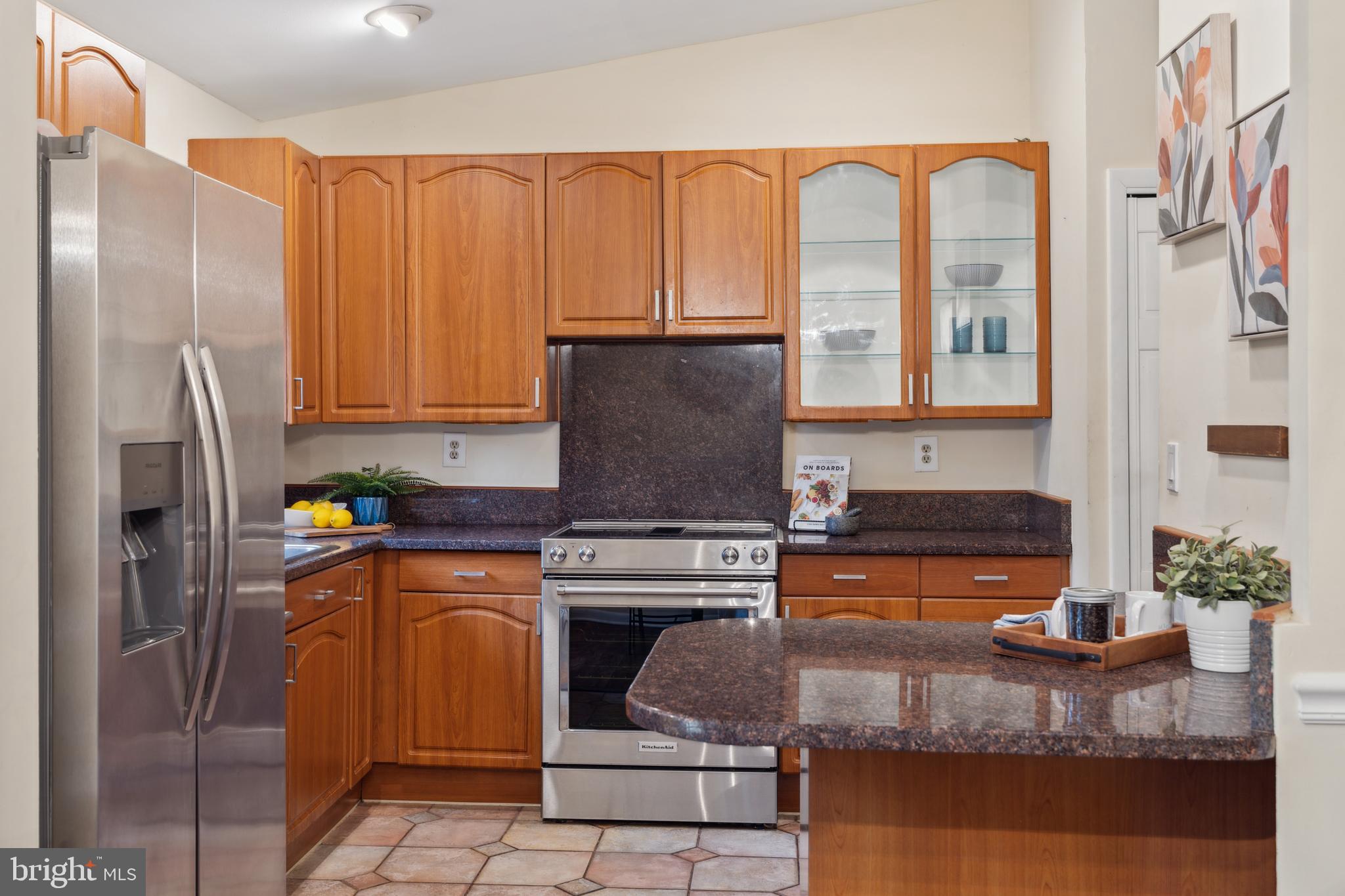 698 Benfield Road Severna Park, MD 21146 - Photo 7 of 28 a kitchen with stainless steel appliances granite countertop a refrigerator stove and sink
