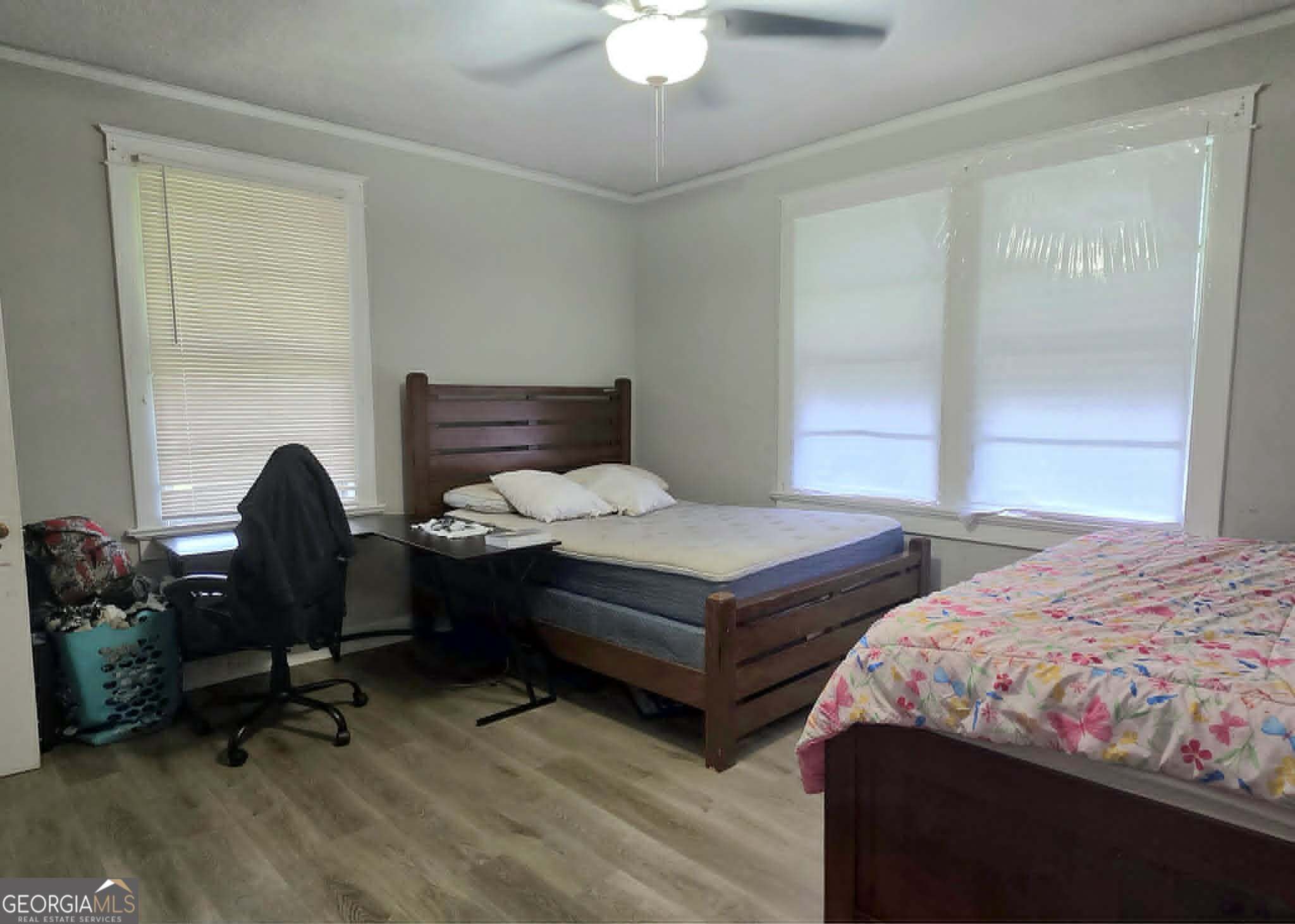 119 O Street Southwest Thomaston, GA 30286 - Photo 6 of 9 a bedroom with two beds and a dresser