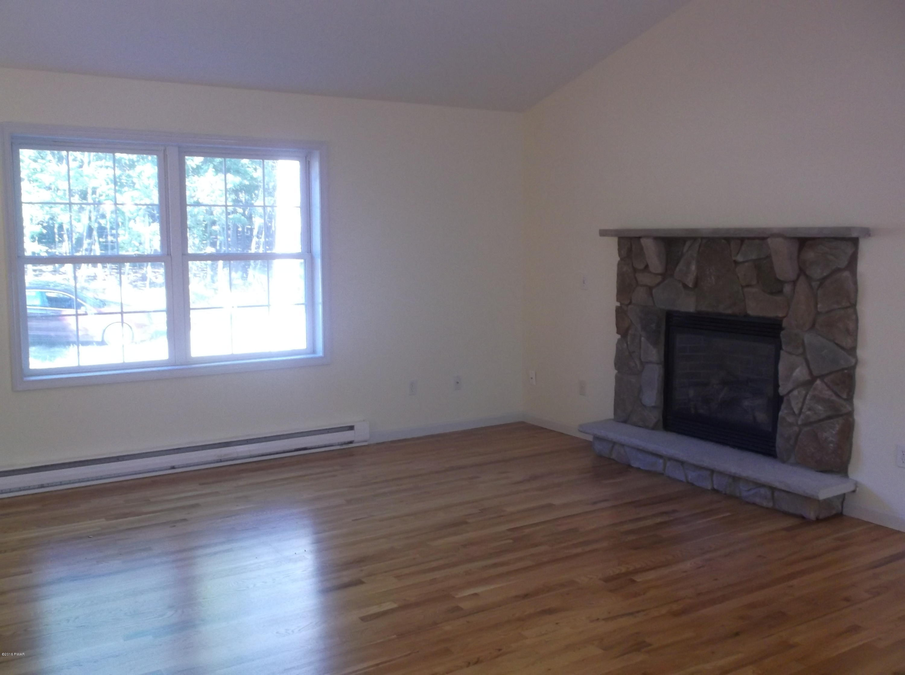 187 Butternut Road Milford, PA 18337 - Photo 6 of 14 Living Room w/ Stone Fireplace