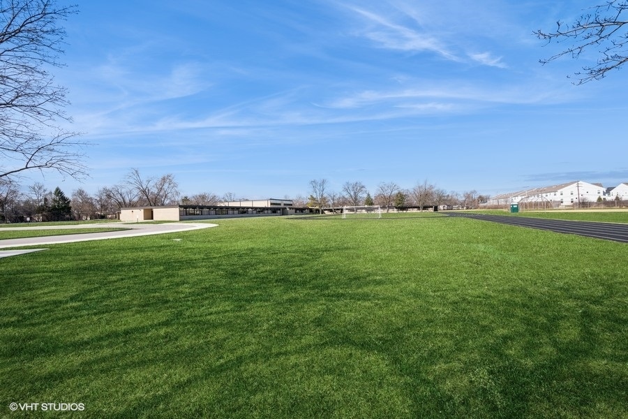 3208 Wren Lane Rolling Meadows, IL 60008 - Photo 18 of 18 a big yard with lots of green space and trees in the background