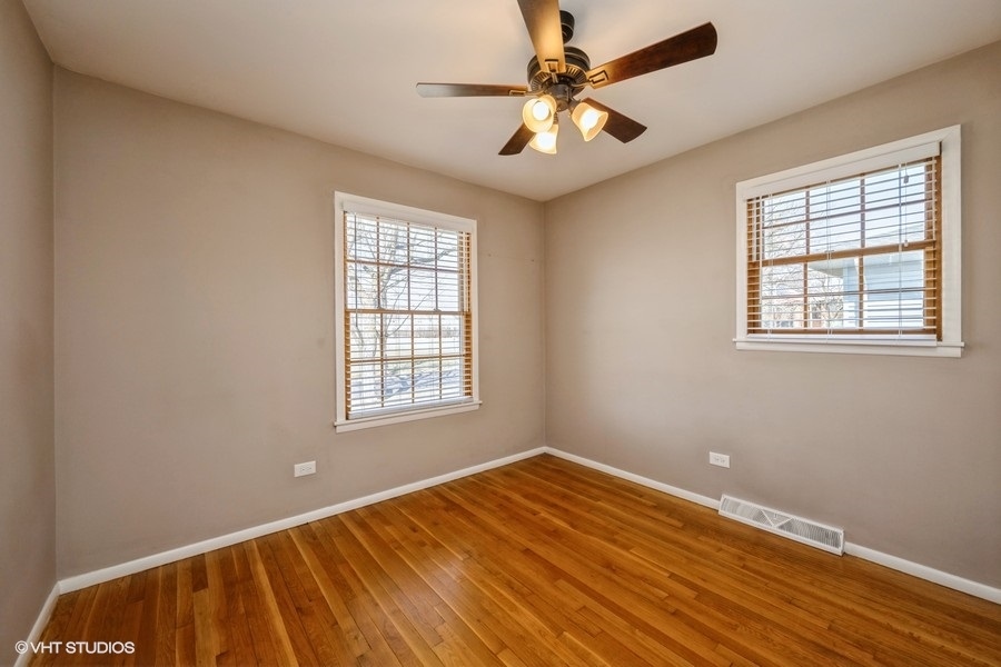 3208 Wren Lane Rolling Meadows, IL 60008 - Photo 10 of 18 a view of an empty room with a window