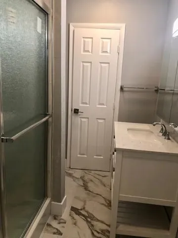 a bathroom with a sink and mirror