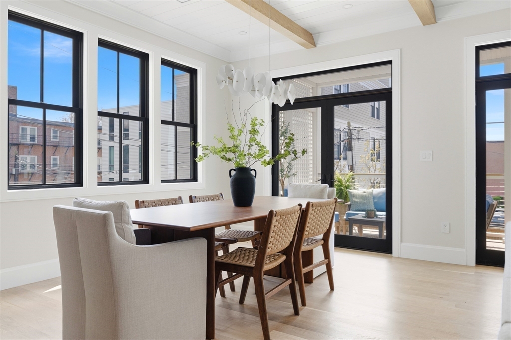 847 East 5th Street, Unit 2 Boston, MA 02127 - Photo 4 of 24 a dining room with furniture window and wooden floor
