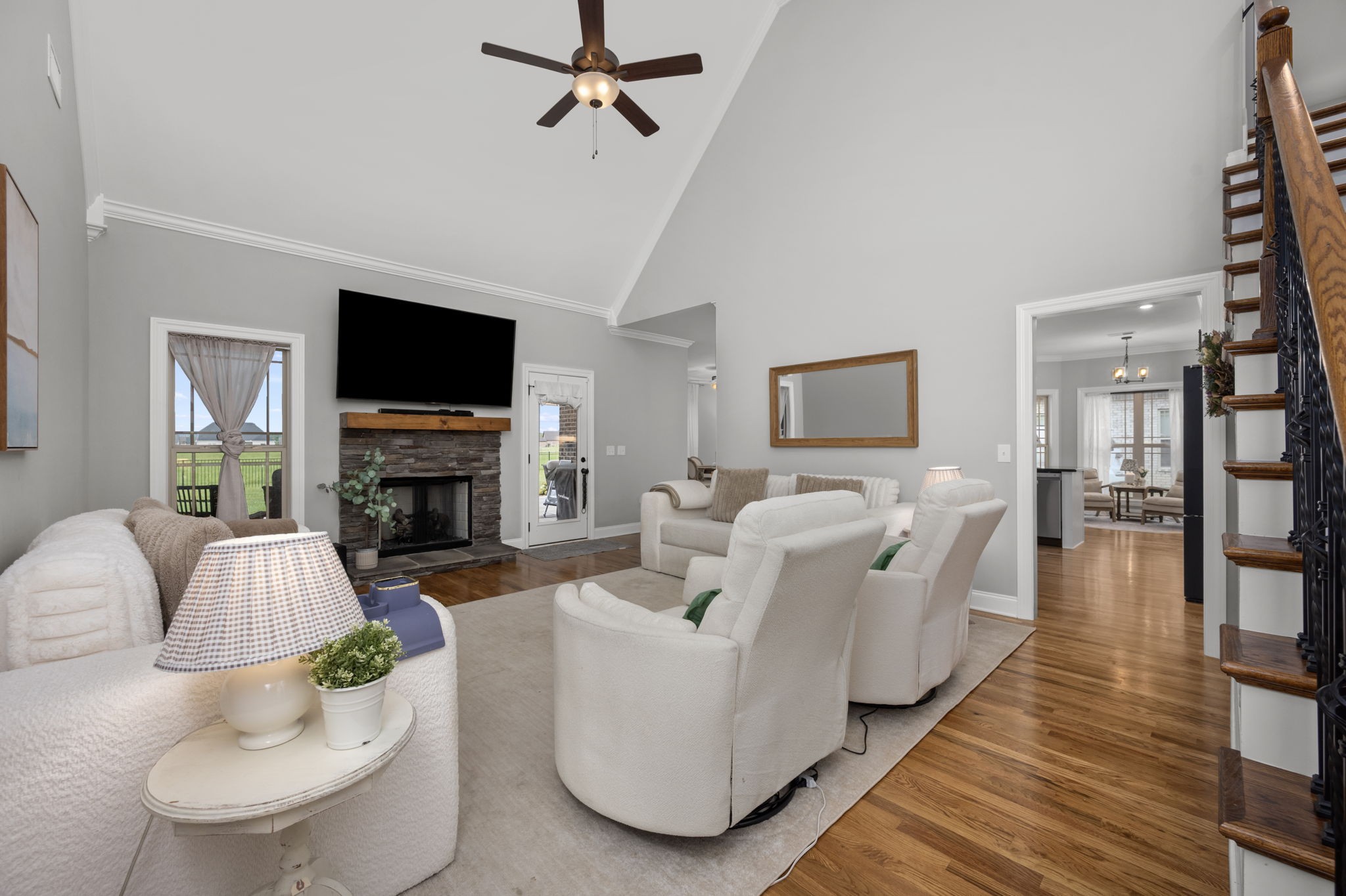 810 Walnut Grove Road Christiana, TN 37037 - Photo 3 of 48 a living room with furniture a fireplace and a flat screen tv