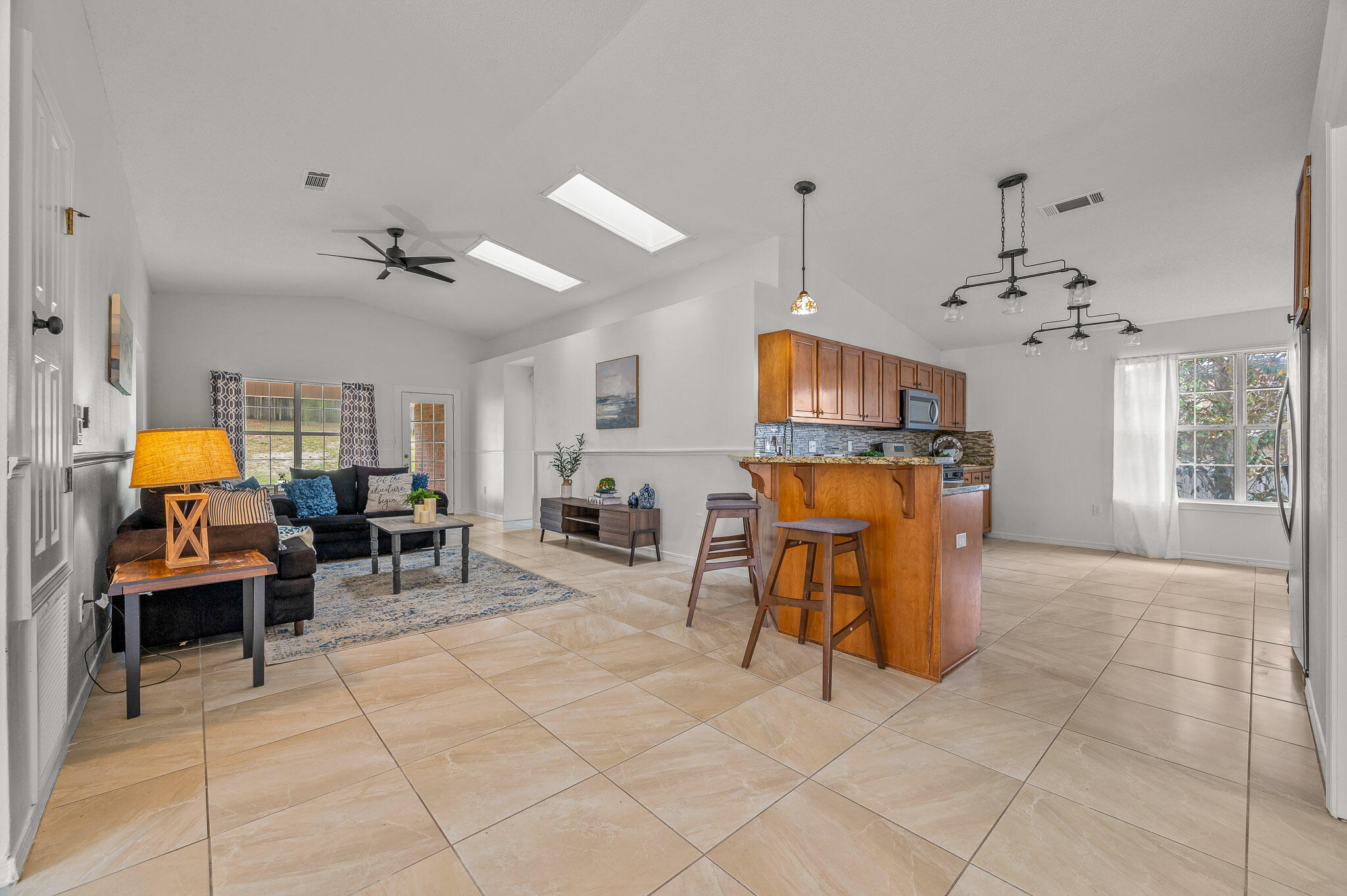 5186 Whitehurst Lane Crestview, FL 32536 - Photo 13 of 55 a living room with furniture and a chandelier