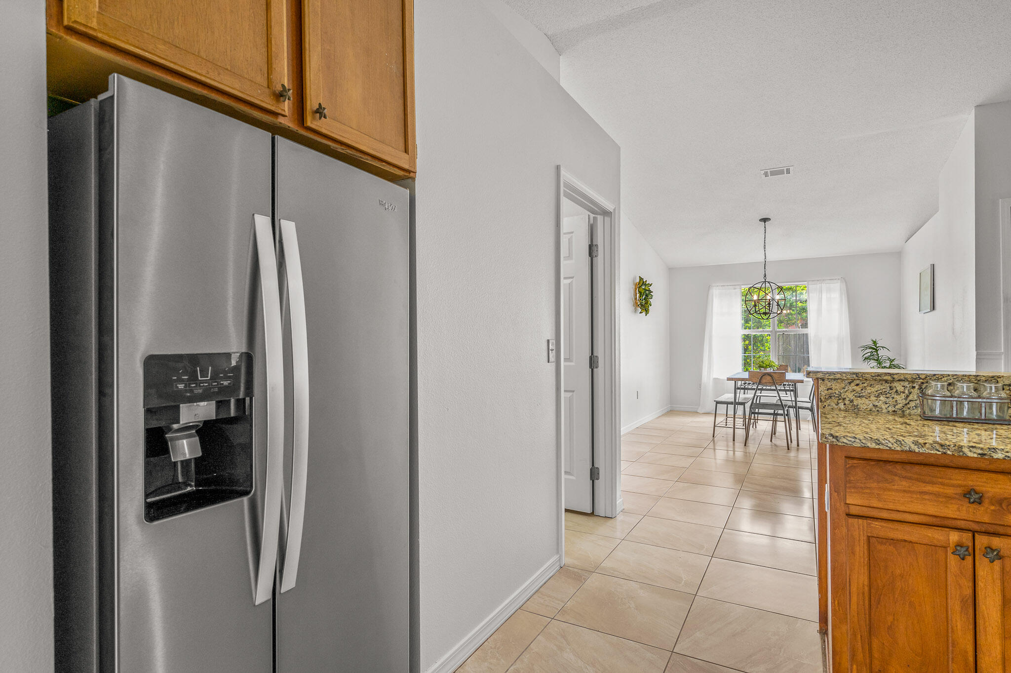5186 Whitehurst Lane Crestview, FL 32536 - Photo 25 of 55 a kitchen with stainless steel appliances granite countertop a refrigerator and a refrigerator