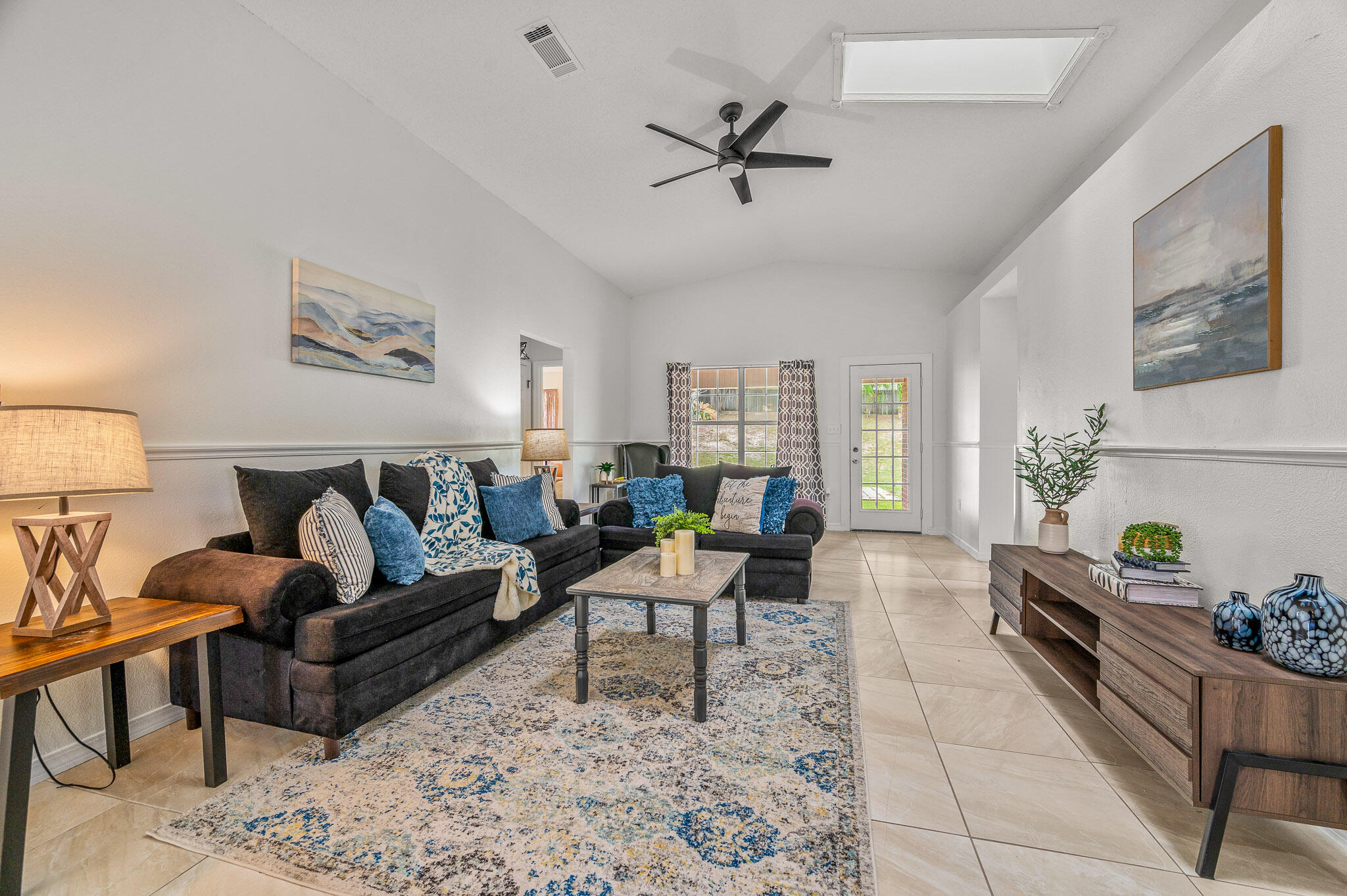 5186 Whitehurst Lane Crestview, FL 32536 - Photo 28 of 55 a living room with furniture and a wooden floor