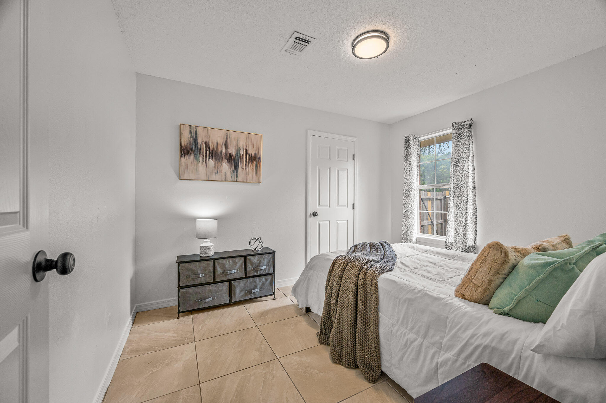 5186 Whitehurst Lane Crestview, FL 32536 - Photo 33 of 55 a bedroom with a bed and a window