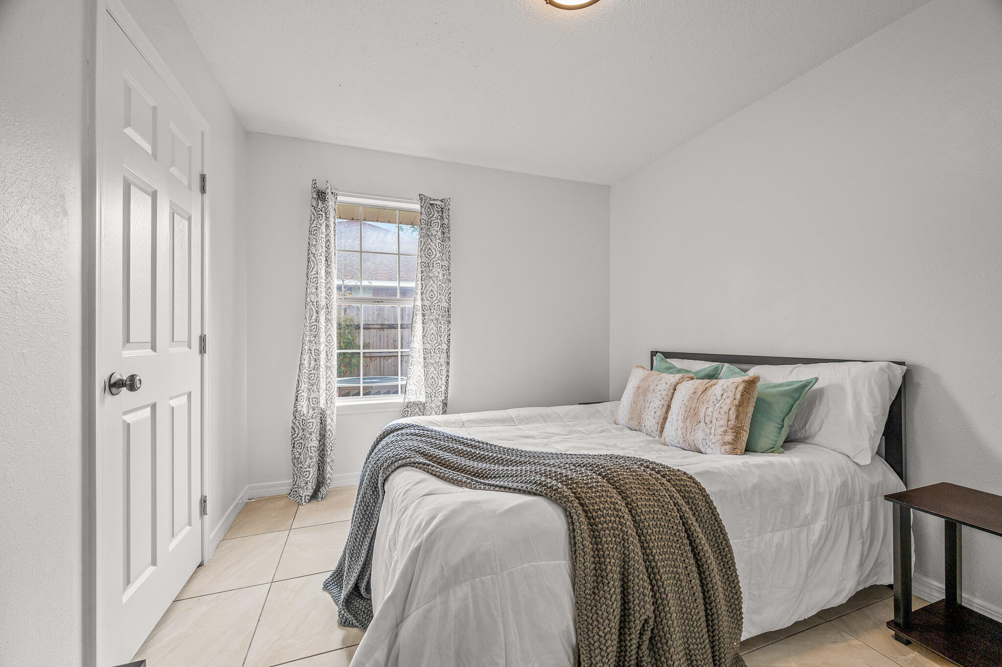 5186 Whitehurst Lane Crestview, FL 32536 - Photo 34 of 55 a bedroom with a bed next to a window