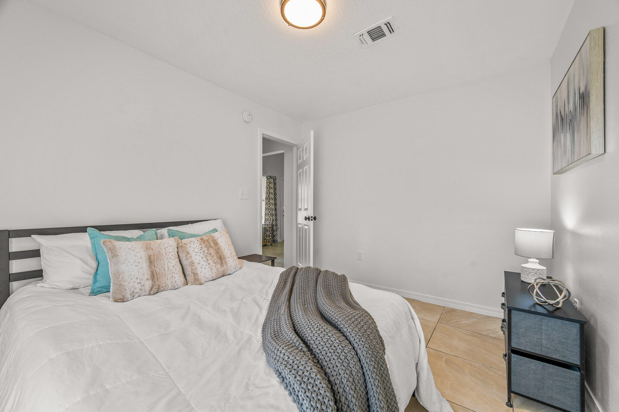 5186 Whitehurst Lane Crestview, FL 32536 - Photo 35 of 55 a bedroom with a bed and dresser