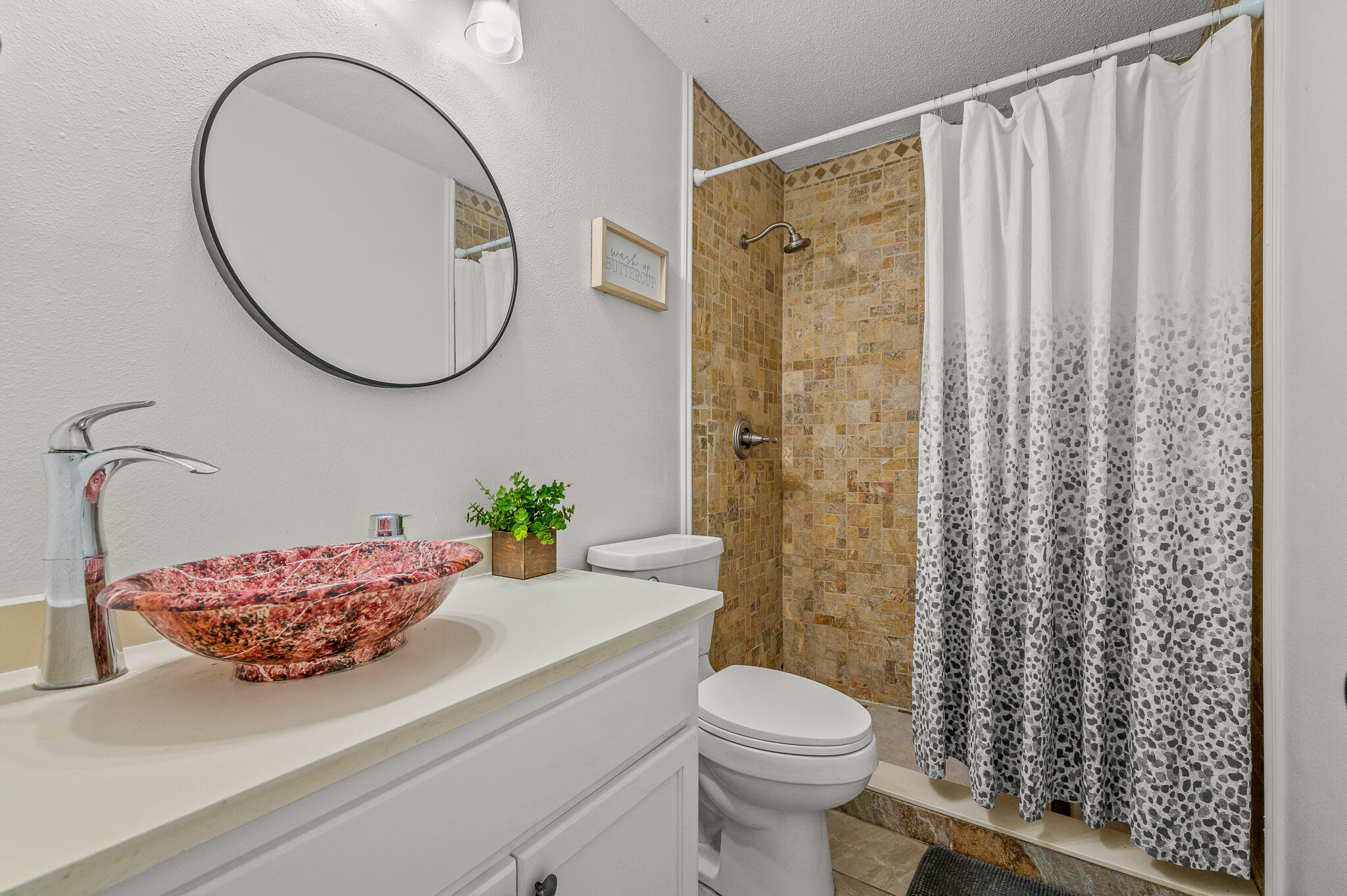 5186 Whitehurst Lane Crestview, FL 32536 - Photo 37 of 55 a bathroom with a sink a toilet and a mirror