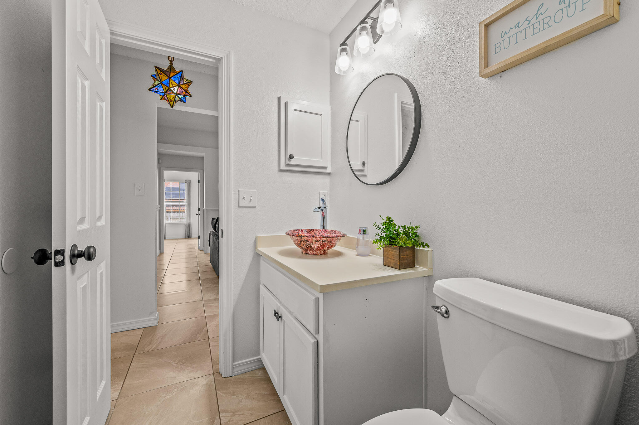 5186 Whitehurst Lane Crestview, FL 32536 - Photo 39 of 55 a bathroom with a sink mirror vanity and toilet