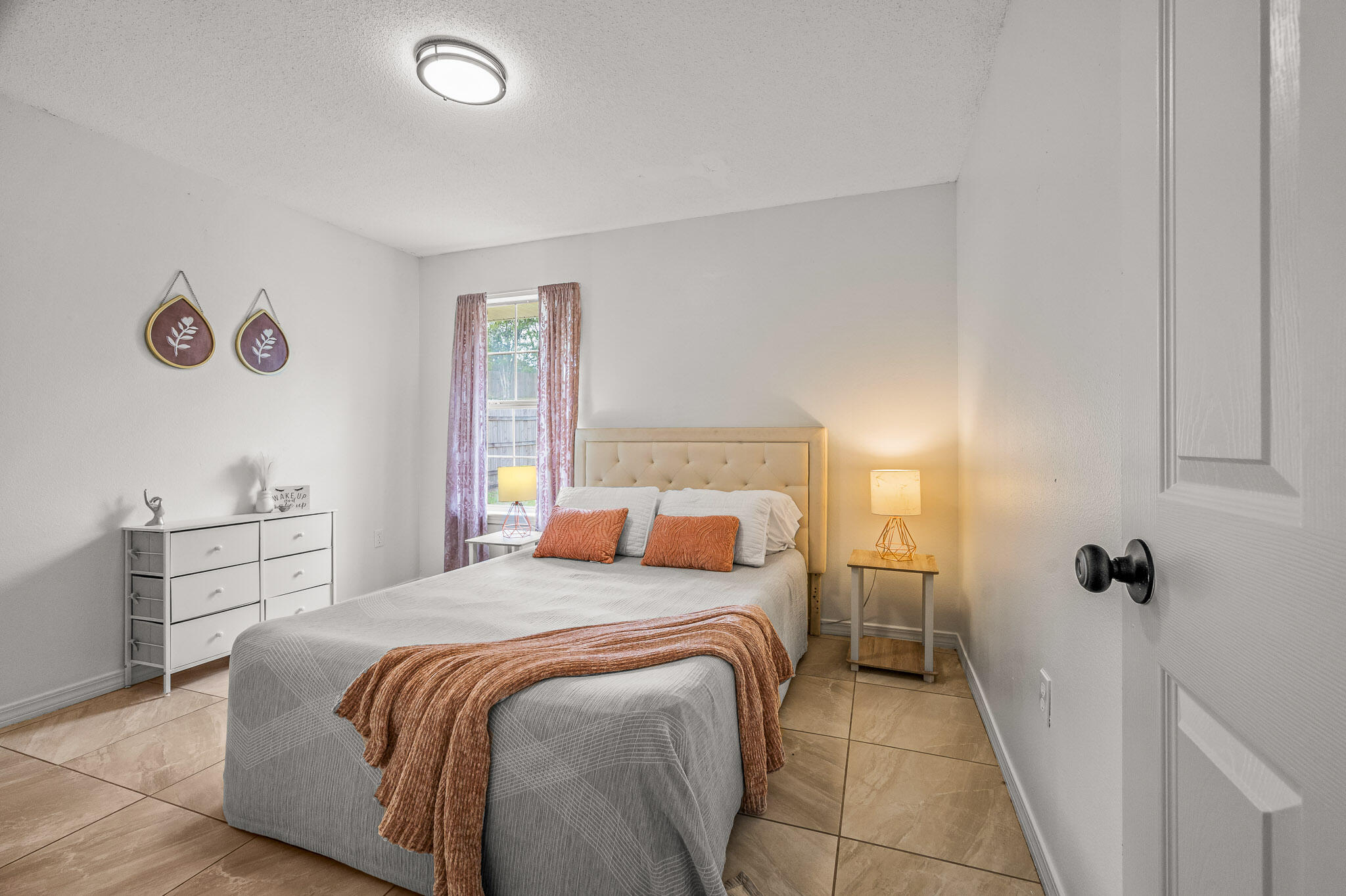 5186 Whitehurst Lane Crestview, FL 32536 - Photo 40 of 55 a bedroom with a bed and a table