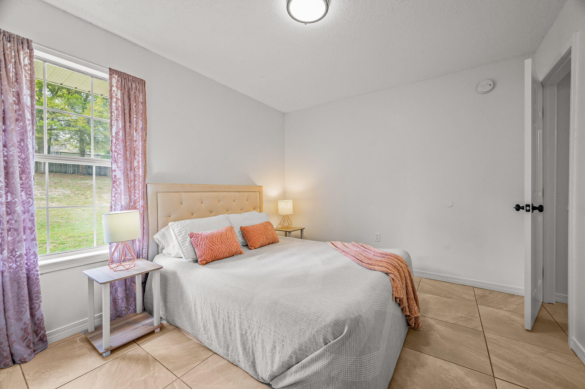 5186 Whitehurst Lane Crestview, FL 32536 - Photo 42 of 55 a bedroom with a bed and a window