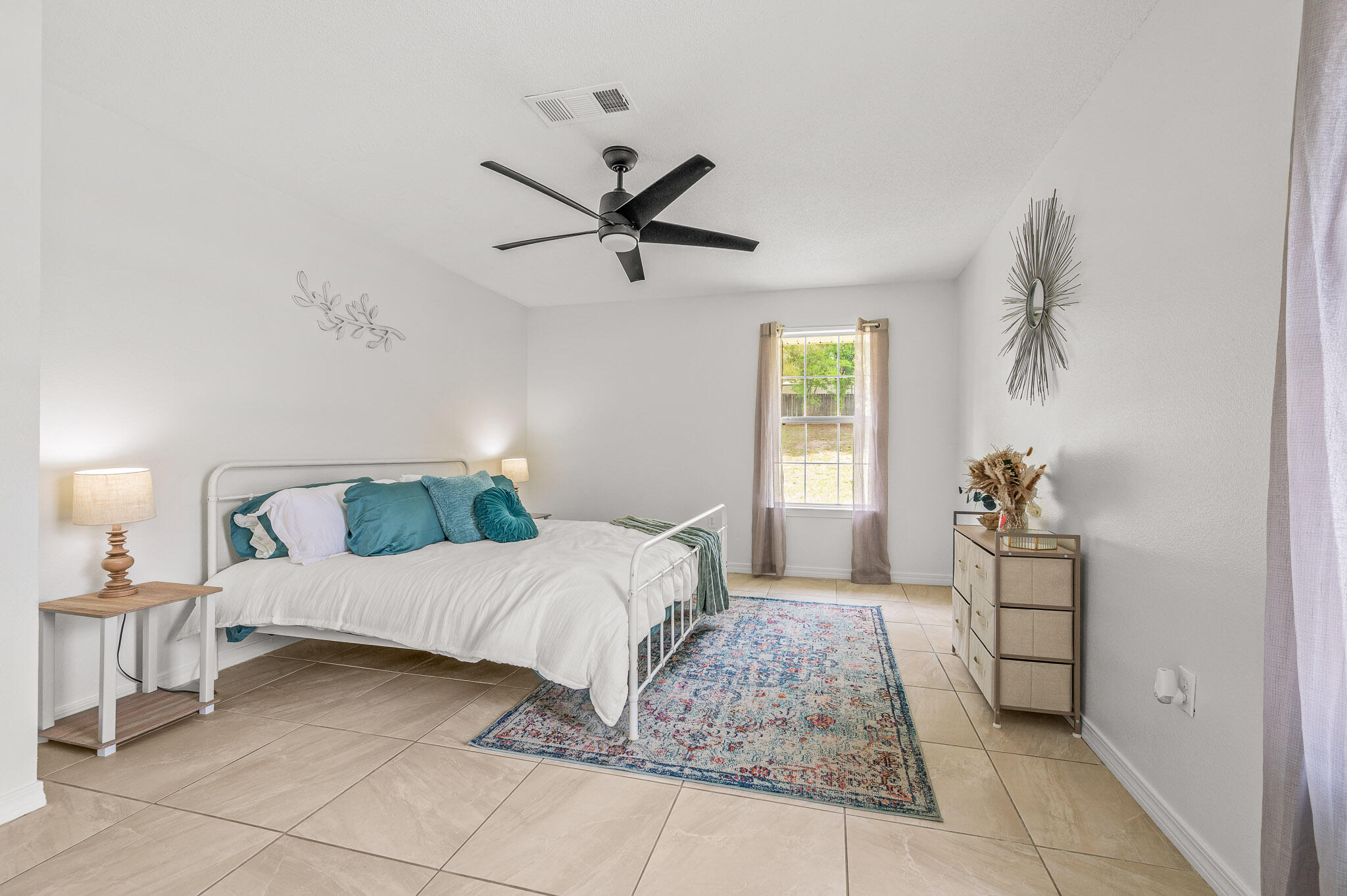 5186 Whitehurst Lane Crestview, FL 32536 - Photo 46 of 55 a bedroom with a bed and a chandelier