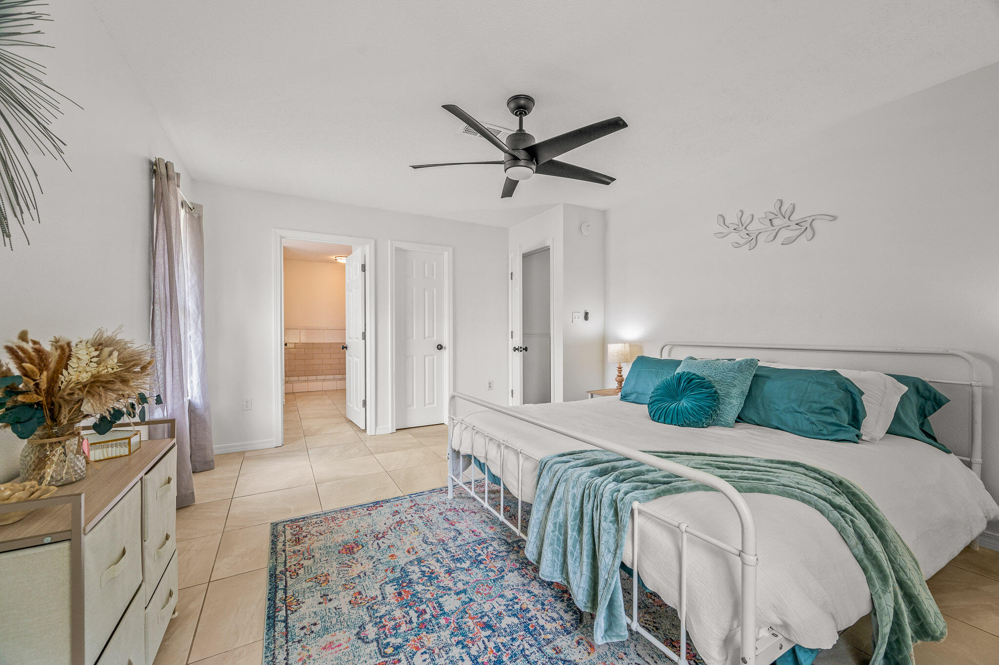 5186 Whitehurst Lane Crestview, FL 32536 - Photo 47 of 55 a bedroom with a bed and a chandelier