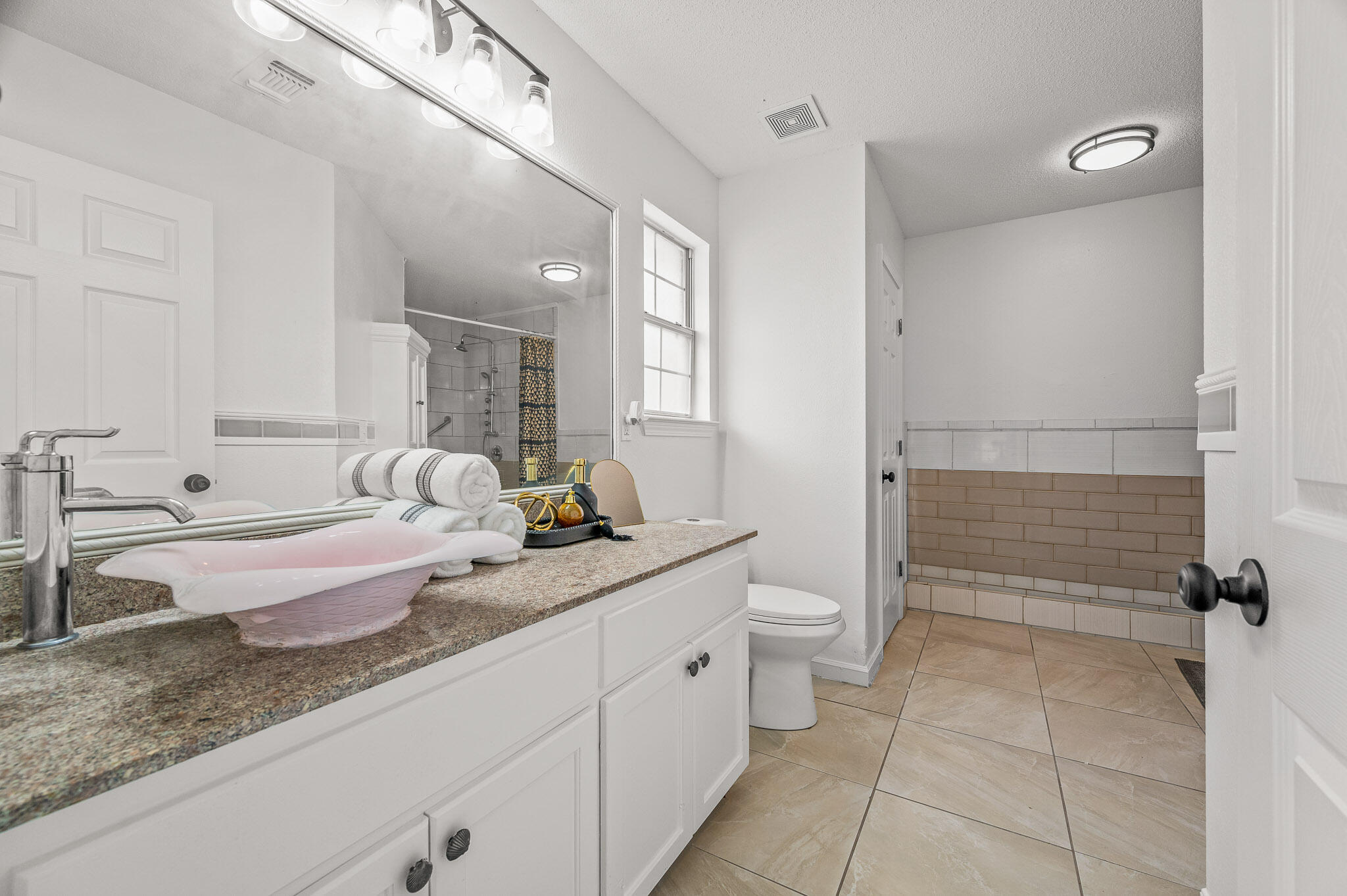 5186 Whitehurst Lane Crestview, FL 32536 - Photo 48 of 55 a bathroom with a granite countertop sink mirror and toilet
