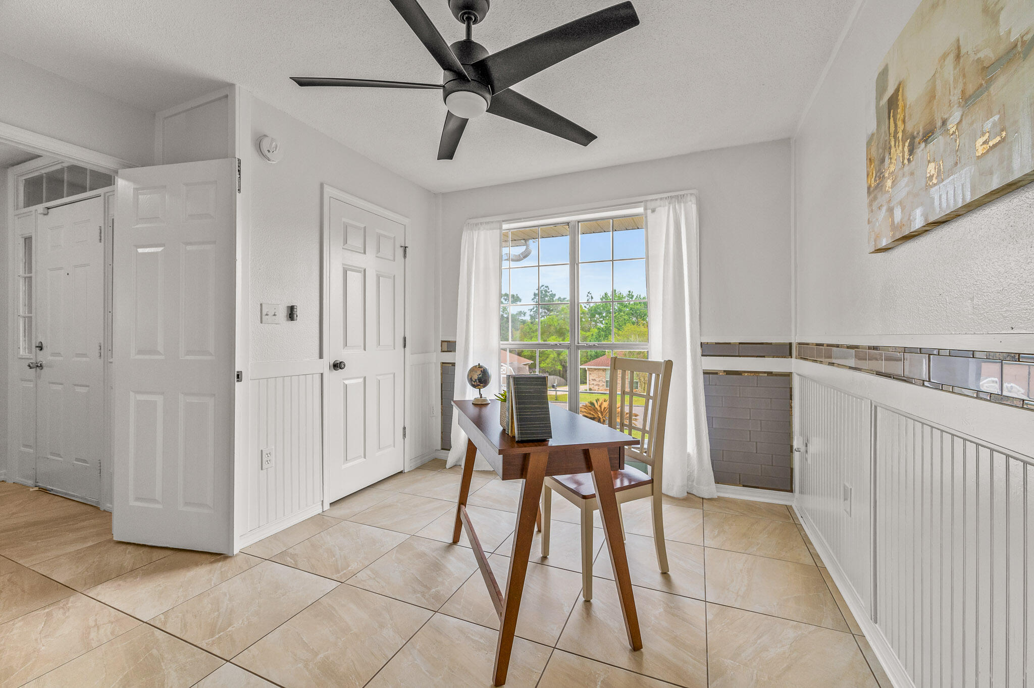 5186 Whitehurst Lane Crestview, FL 32536 - Photo 8 of 55 a dining room with furniture and a floor to ceiling window