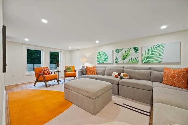 a living room with furniture and a large window