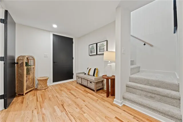 a spacious bedroom with a bed and a chandelier