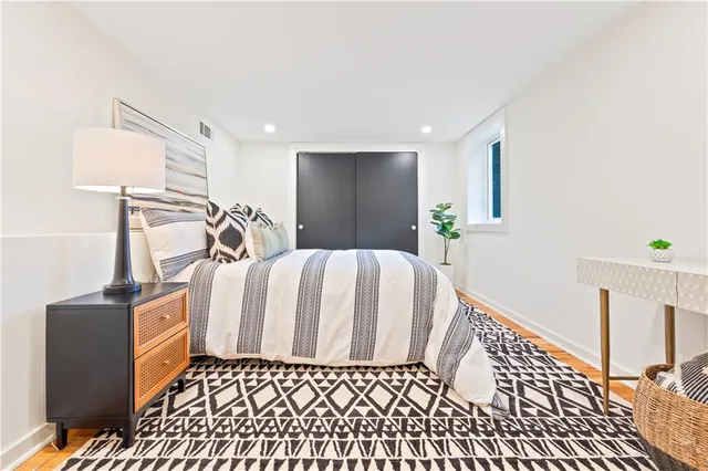 a bedroom with a bed and a walk in closet