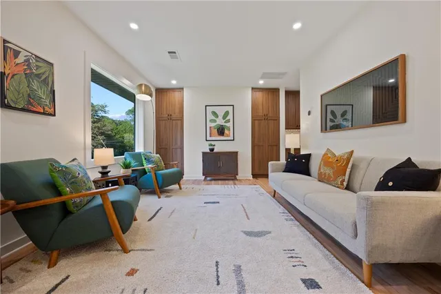a living room with furniture window and lamp