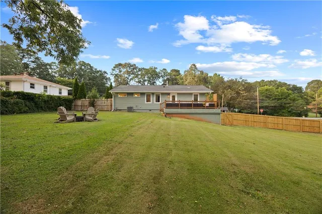 a view of a lake with a house in the background