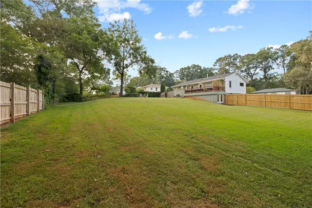 a view of an ocean yard and mountain view in back