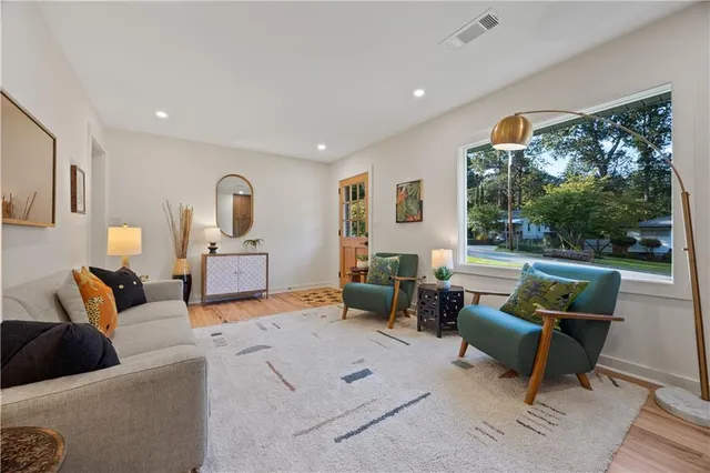 a living room with furniture and a large window
