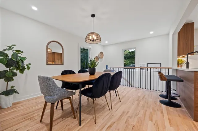 a view of a dining room with furniture window and wooden floor