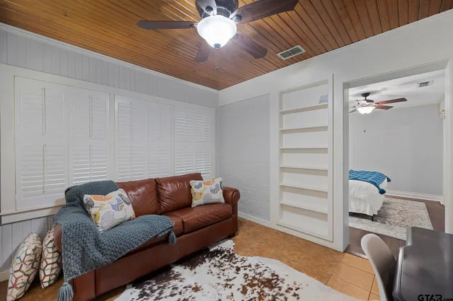 a living room with furniture and a rug