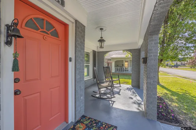 a view of swimming pool with a table and chairs