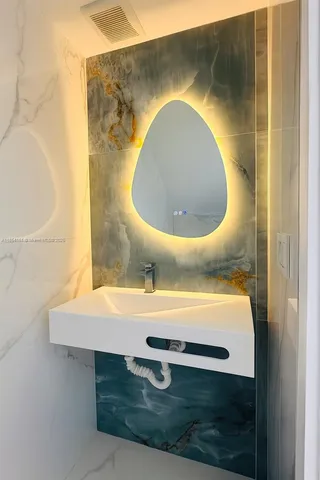 a bathroom with a tub and a sink