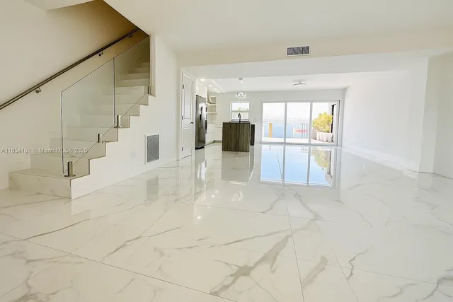 a view of a kitchen with a sink