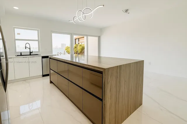 a kitchen with sink and window