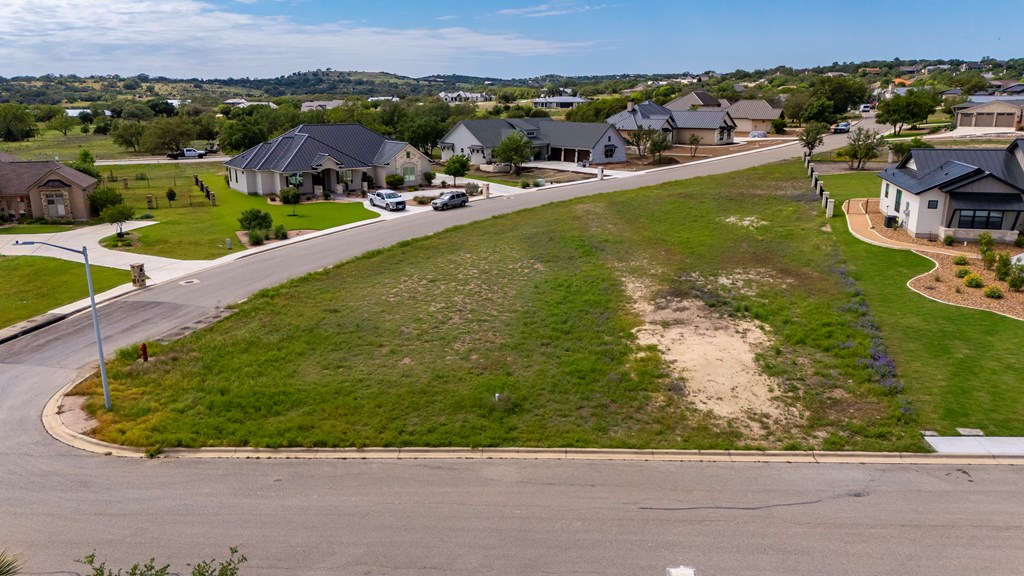 1024 Pinnacle View Drive Kerrville, TX 78028 - Photo 4 of 19 an aerial view of a house with a garden and lake view