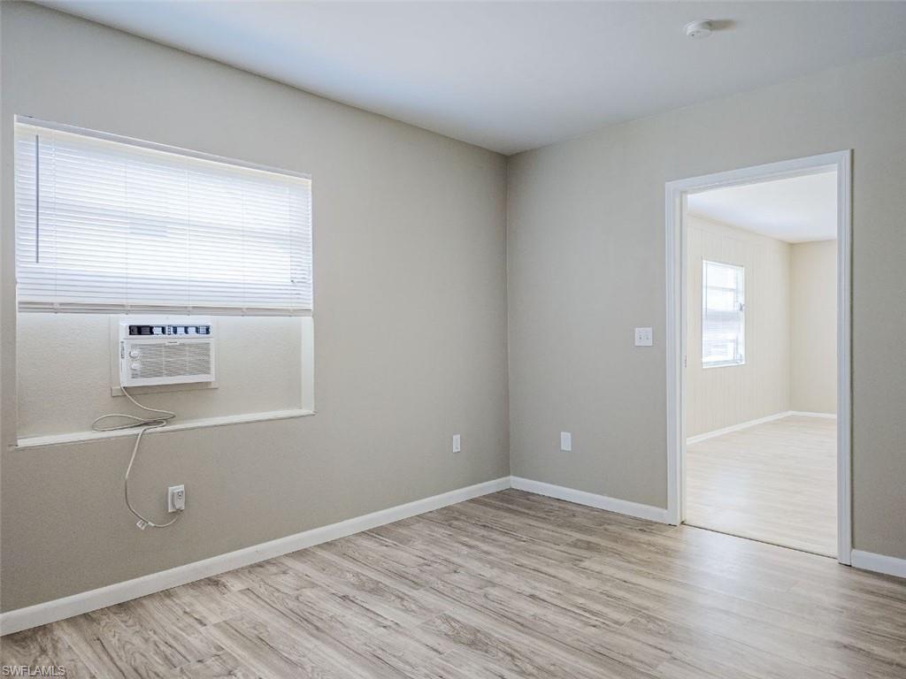 3488 Roberts Street Mims, FL 32754 - Photo 6 of 15 an empty room with wooden floor and windows