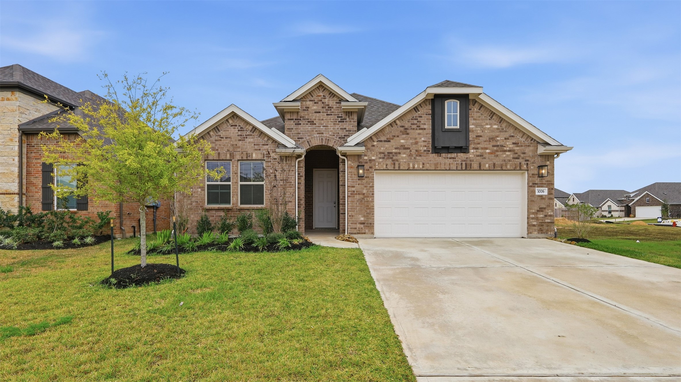 3006 Myrtle Bch Lane League City, TX 77573 - Photo 19 of 21 a front view of a house with a yard and garage