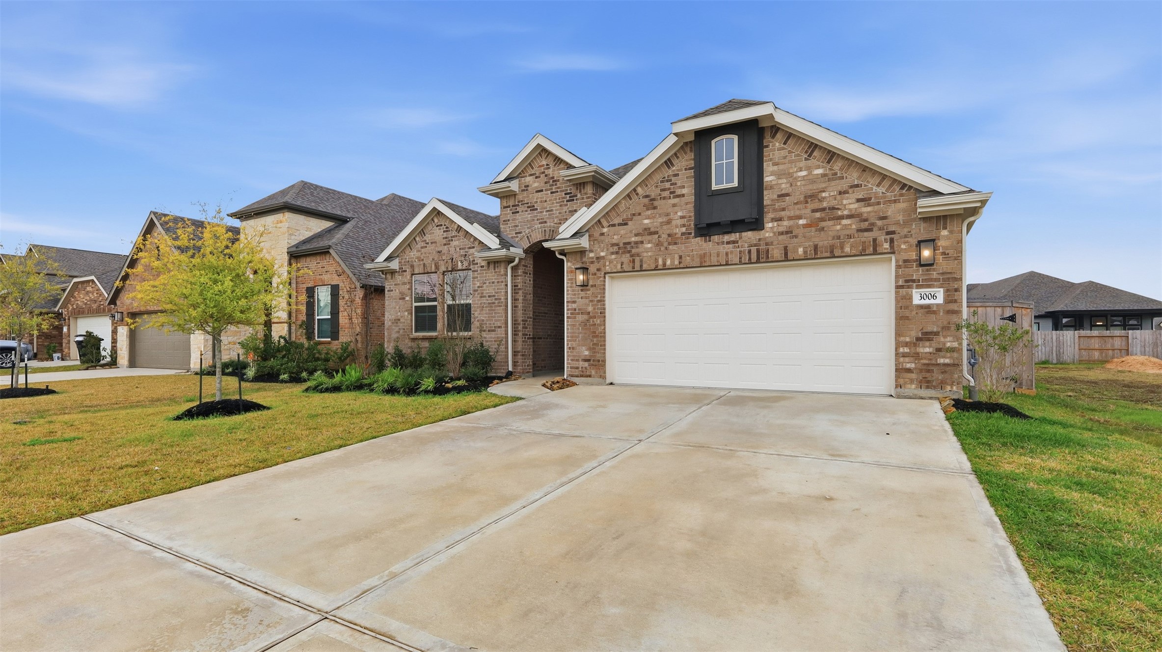 3006 Myrtle Bch Lane League City, TX 77573 - Photo 2 of 21 a front view of a house with a yard and garage