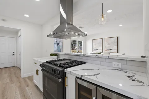 a kitchen with a sink and cabinets