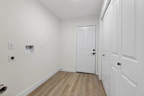 a bathroom with a shower and mirror