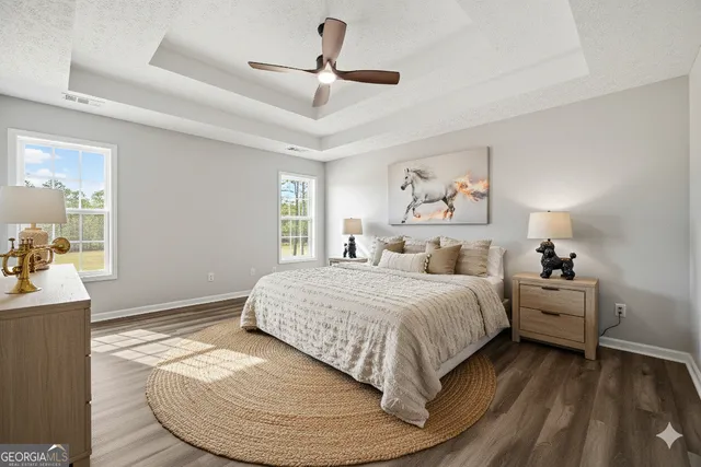 a white bath tub sitting in a bathroom next to a window