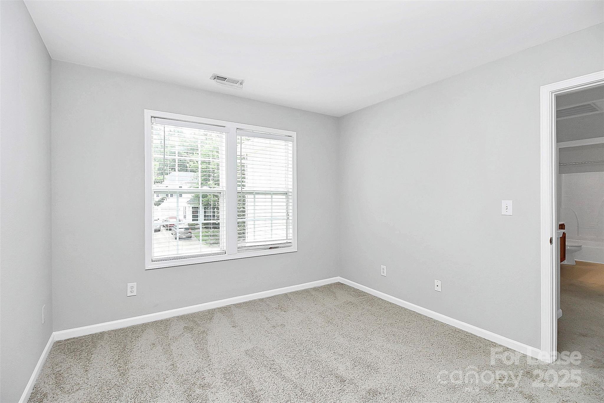 11263 Heritage Green Drive Cornelius, NC 28031 - Photo 21 of 32 an empty room with a window