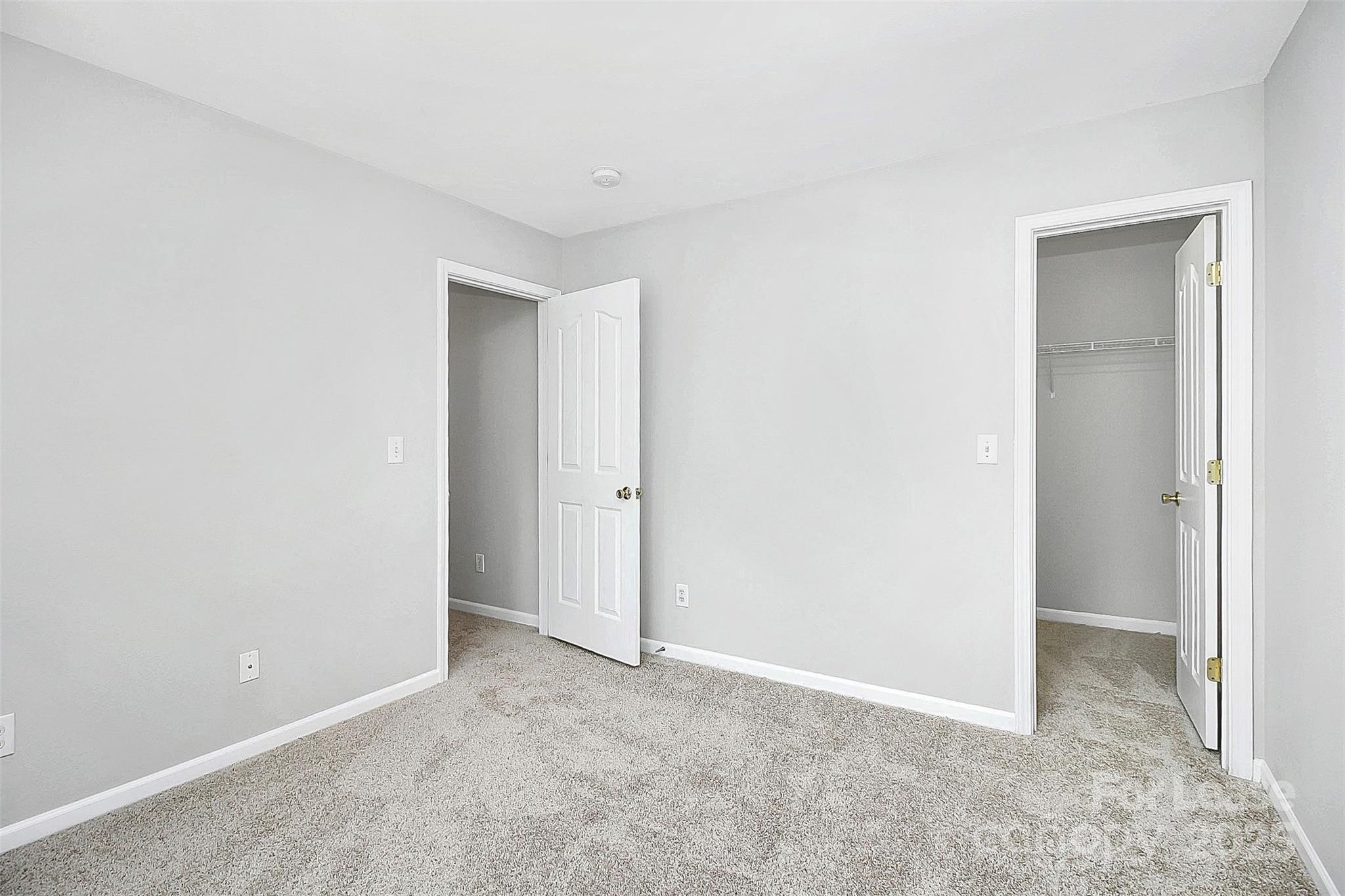 11263 Heritage Green Drive Cornelius, NC 28031 - Photo 22 of 32 a view of an empty room and closet area