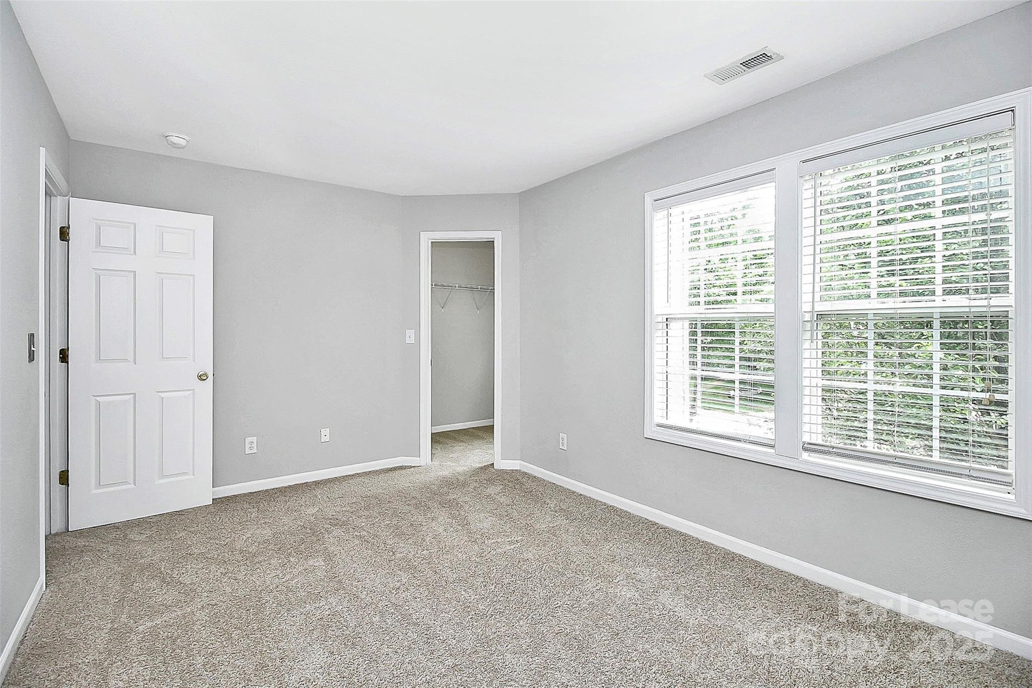 11263 Heritage Green Drive Cornelius, NC 28031 - Photo 25 of 32 a view of an empty room with a window