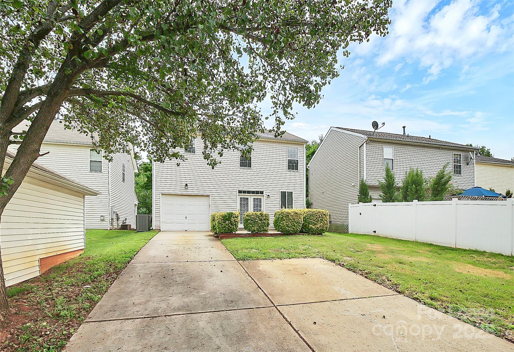 11263 Heritage Green Drive Cornelius, NC 28031 - Photo 27 of 32 a front view of a house with garden