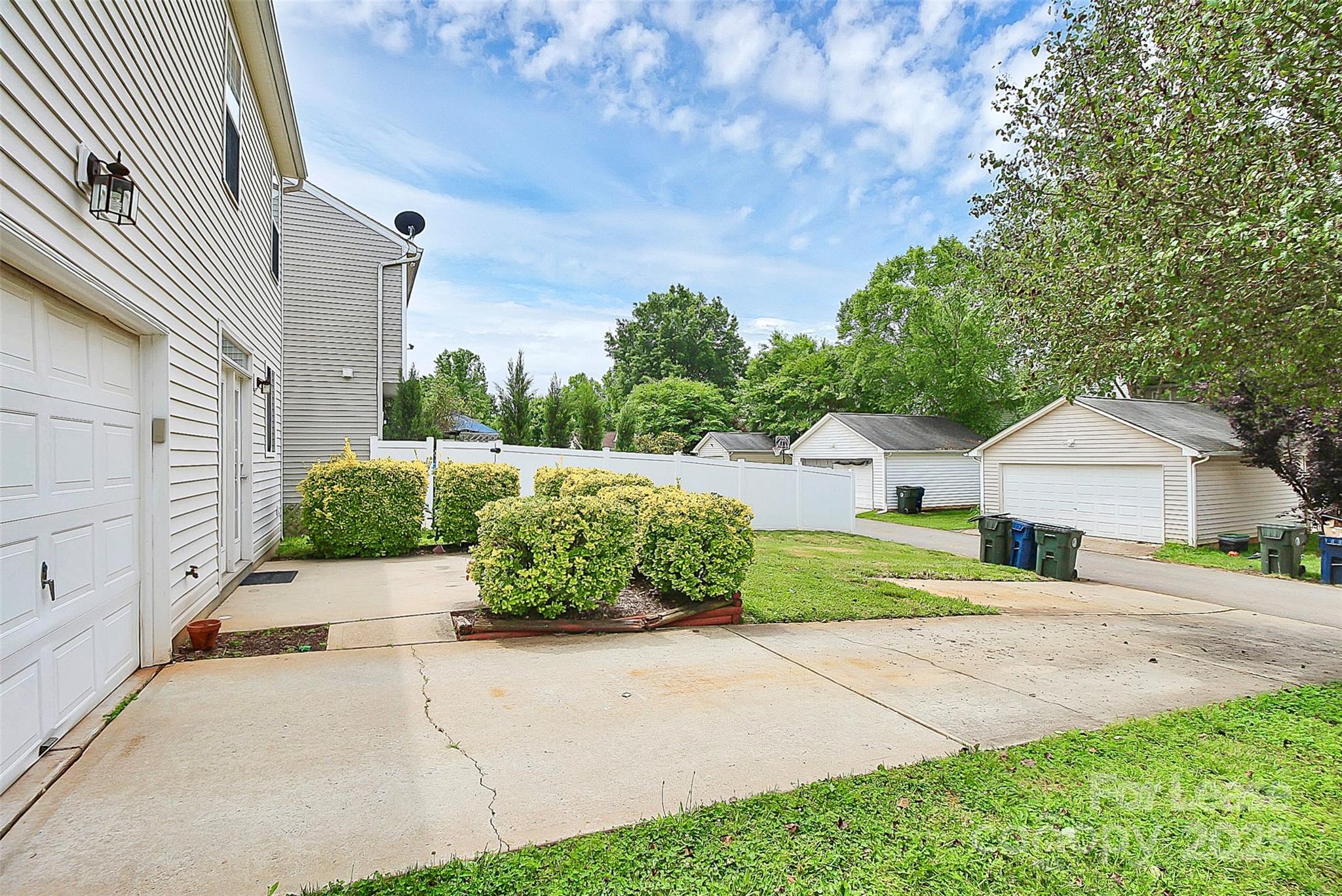 11263 Heritage Green Drive Cornelius, NC 28031 - Photo 29 of 32 a front view of a house with a yard and garage