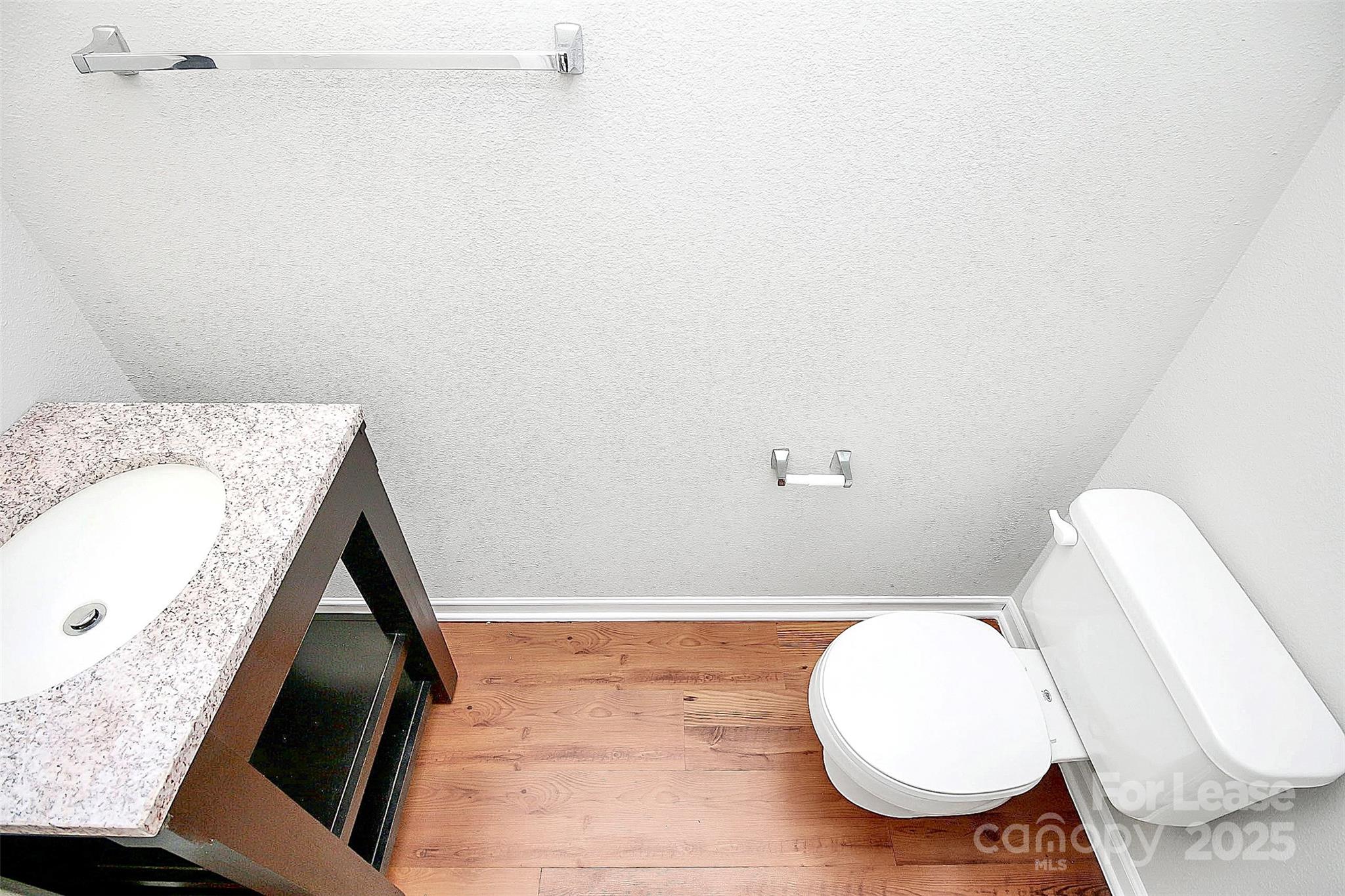 11263 Heritage Green Drive Cornelius, NC 28031 - Photo 7 of 32 a bathroom with a sink and toilet
