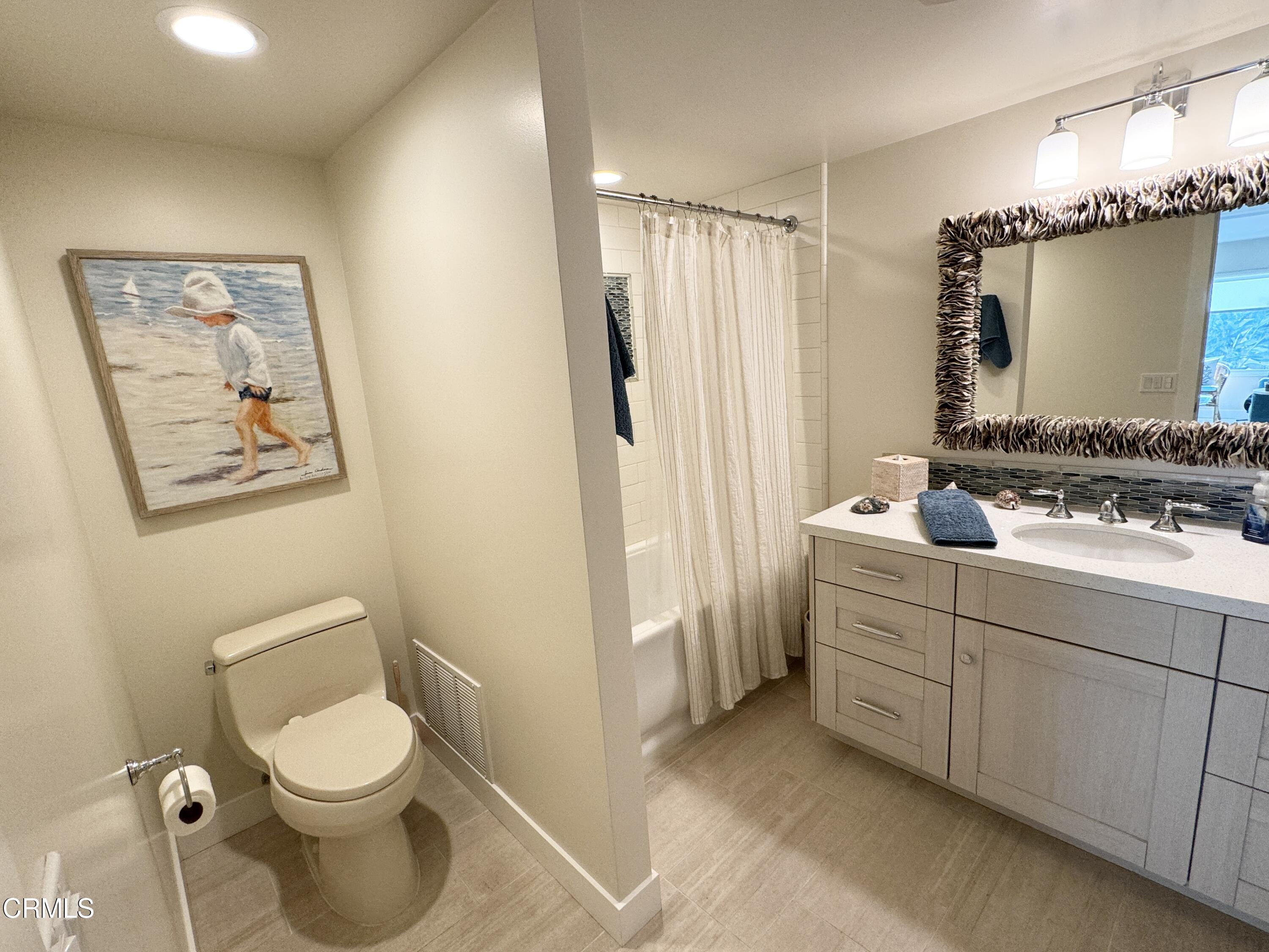 1915 Majorca Drive Oxnard, CA 93035 - Photo 14 of 29 a bathroom with a toilet sink and mirror