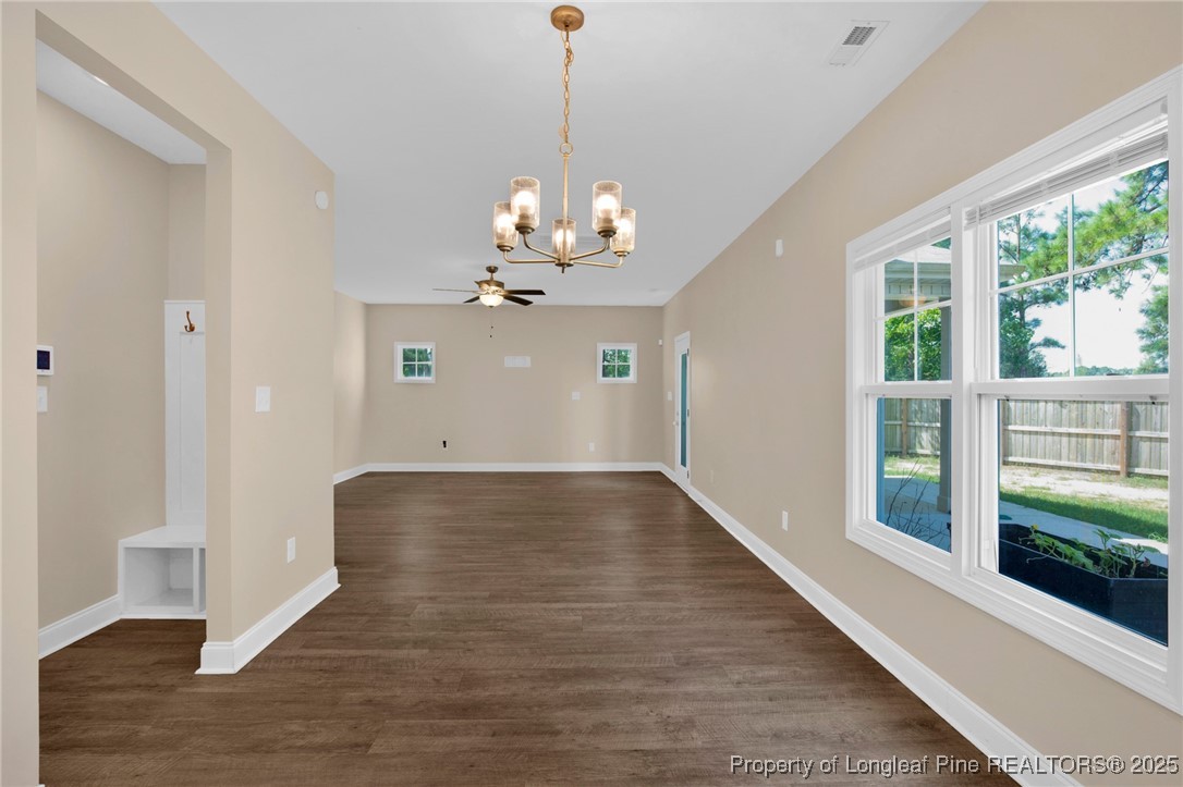 405 Shelton Beard Road Stedman, NC 28391 - Photo 16 of 36 a view of a hallway with wooden floor and staircase